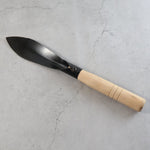 Gardening trowel ideal for soil work in home gardens and landscapes