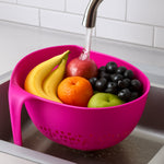 Close-up of ergonomic handle on triangular kitchen colander for comfortable grip