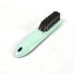 The versatile household scrubber shown with water, ready for deep cleaning.