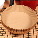 Pack of 50 round air fryer liners, ready for convenient kitchen use.