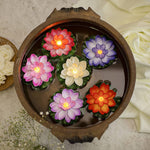 Detailed view of the plastic lotus petals and the LED light mechanism of a floating candle.
