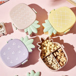 Closed pineapple shaped kids bento lunch box ready for school.