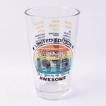 Transparent glass tumbler with trivia print on white background