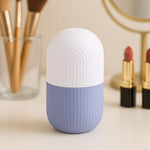 GlowForm purple ice roller with a diamond-cut handle, ready for a refreshing face massage.