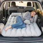 Comfortable woman sleeping on car air mattress
