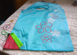 Different colors of washable and foldable reusable grocery bags, ready for heavy loads.