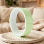 Green packing tape roll front view highlighting compact size