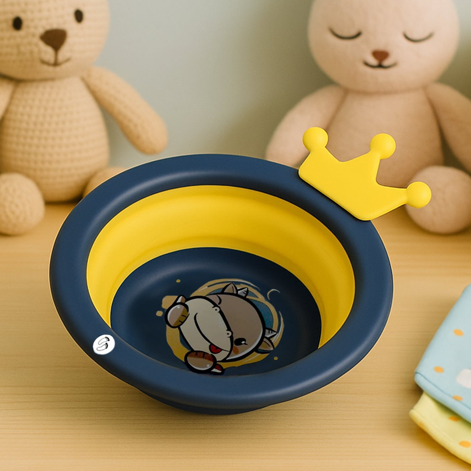 Compactly folded cartoon baby wash basin, demonstrating its space-saving design.