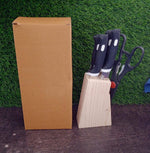 Wooden block knife set holding multiple kitchen knives with sharp serrated edges