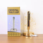 Lifestyle photo of golden crystal leaf LED desk lamp during evening lighting