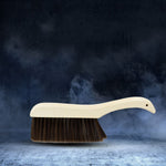 Multipurpose cleaning brush for clothes, sofas, and desks, offering gentle dust removal.