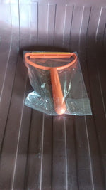The 2-in-1 lint remover displayed with its packaging, ready for use.
