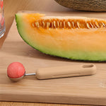 Top view of the 2-in-1 fruit scooper and cutter tool