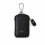 Elegant black PU leather car key case on white background.