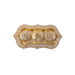 Studio shot of the golden Kankavati on a white background.
