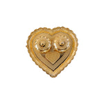 Kumkum holder with white background highlighting golden design