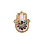 White background showing detailed view of hand-shaped kankavati