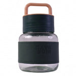 Glass water bottle with white background highlighting sleek design