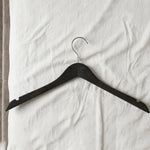 Hanger in use for wardrobe organization and clothes hanging