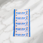 BrightAid medicated dressing strips in sterile packaging.