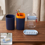 Tumbler, toothbrush holder, and soap dish in a modern bathroom accessories set