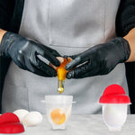A hand easily removing a perfectly cooked egg from the multi-functional egg mold.