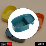 Compact drying rack and sink basket for efficient kitchen organization.