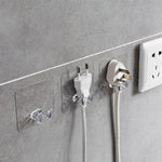Set of transparent wall storage hooks arranged in a kitchen for efficient organization.