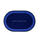 Oval shaped non-slip bath mat positioned on bathroom floor