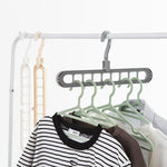 Front view of the Organivo 9-hole plastic hanger, showcasing its multi-slot design.