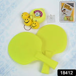 Child practicing with the hanging table tennis trainer, showing adjustable string.