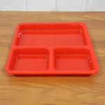 Ergonomic design of the plastic 3-compartment meal serving tray.