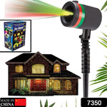 Multicolor outdoor laser projector displaying star motion patterns on a house.