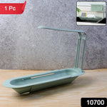 Adjustable kitchen sink rack organiser with cleaning tools on countertop