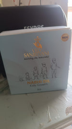 Close-up of natural herbal Kids Growth Nabhi Oil for bone and height support