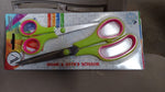 Detailed view of the rust-resistant stainless steel blades of the scissor set.