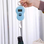 Compact digital weighing scale with LCD display, ideal for travel.