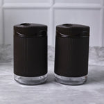Salt and pepper dispenser set featuring transparent bases for easy spice monitoring