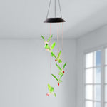 Hummingbird solar wind chimes glowing with vibrant colored LEDs