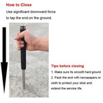 The self-defense stick folded, highlighting the secure wrist strap.