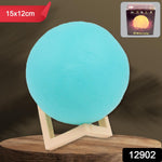 Close-up of the blue Moon Night Lamp with its sturdy plastic stand, showcasing the detailed 3D texture.