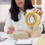 Transparent packing tape roll, high adhesive, for secure sealing.