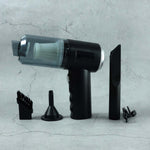 Close-up of the Mini Car Vacuum's nozzle and brush attachments.