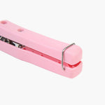 Detail shot of the protective tip on the Hot Dish Plate Clip to prevent scratches.