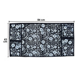 Microwave dust cover with an elegant design protecting a kitchen appliance.