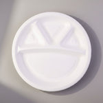Profile view of Vegnar 4 compartment disposable food serving plate