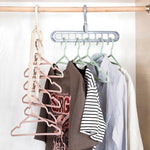 The multi-functional 9-hole hanger efficiently organizes various clothes inside a closet.