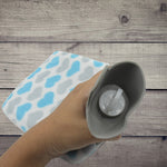 Front view of the hot water bag with its protective fabric cover.