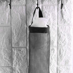 Back view of the waste bag holder, showing the wide handle for easy hanging on a hook.