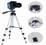A Gambit camera tripod with a phone holder extended, ready for capturing photos.